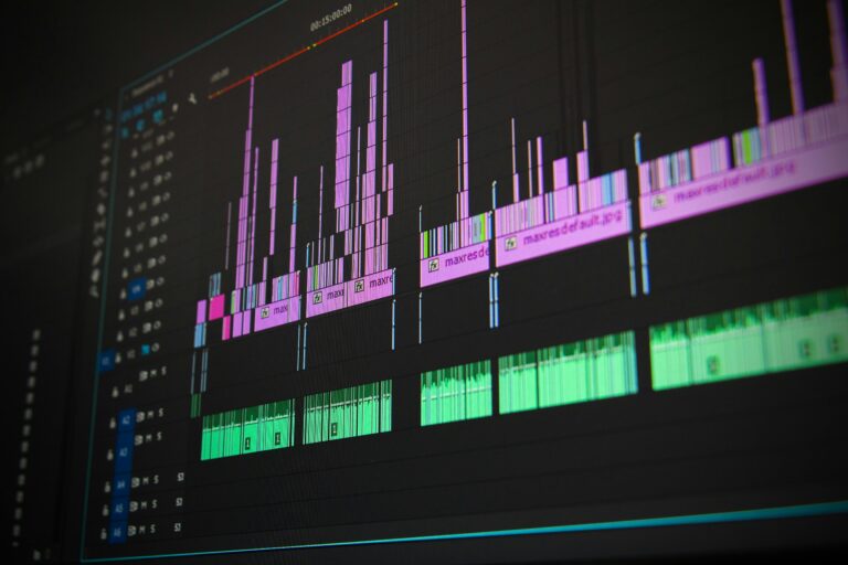 A close-up of a video editing software timeline with colorful audio and video clips, showcasing the detailed process of professional video production